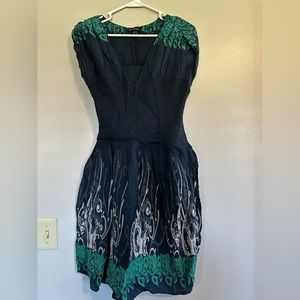 Blue dress with green and cream design